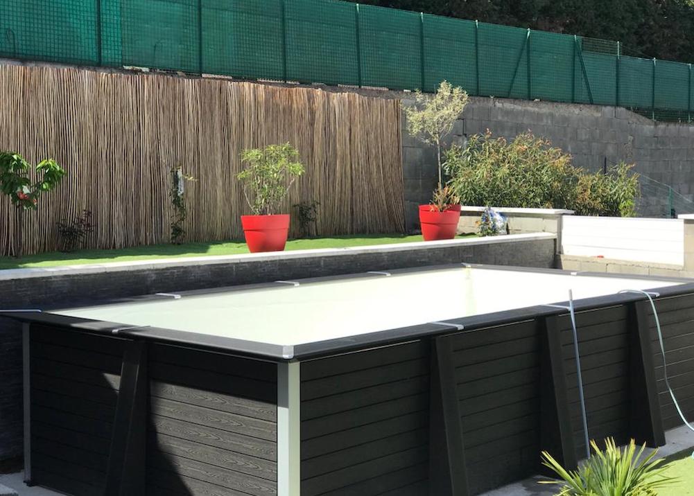 Black rectangular above ground pool side view